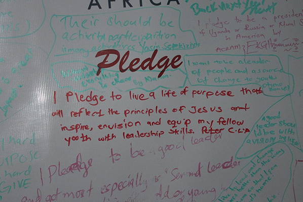 A photo of a white-board with a student's leadership pledge written on it.