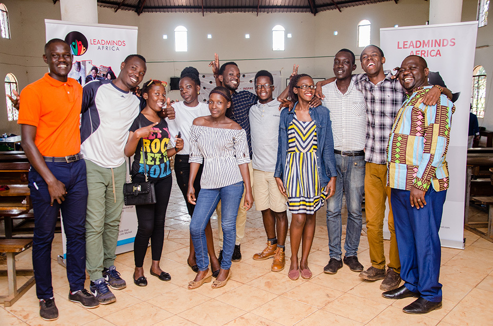 A group of happy LeadMinds Africa students pose together, smiling.