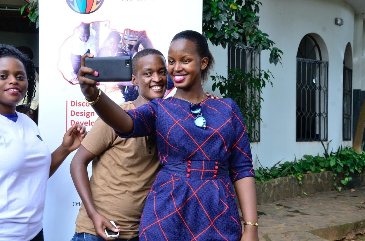 A Leadership mentor takes a selfie with a student.