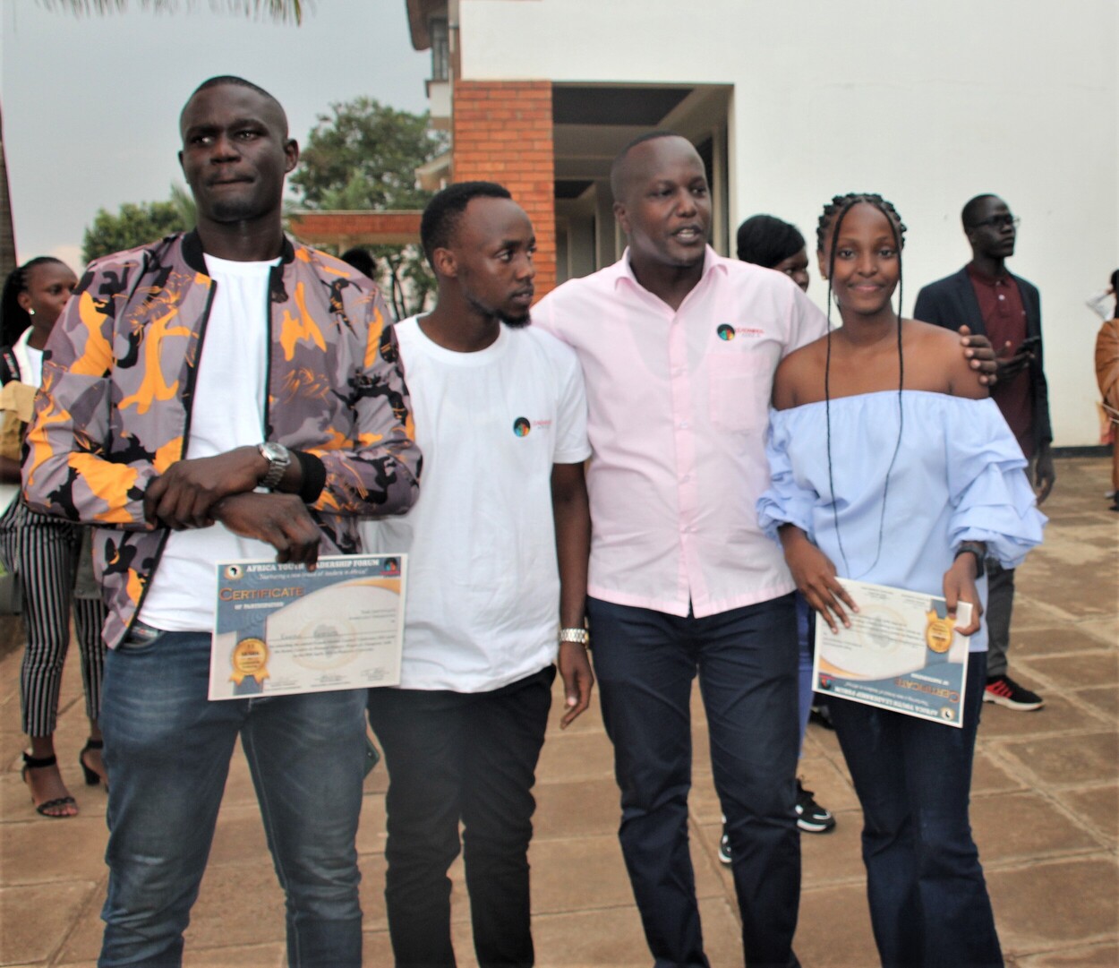 Our Founder Enock with a group of volunteers.