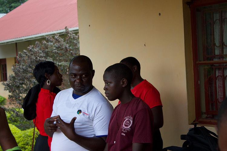 A mentor offering advice to a young adult.